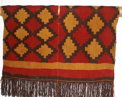Textile: Nazca Tunic with bold stepped/diamond motif in red, brown and gold. $30,000