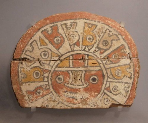 Early Chancay wood painted circular headdress ornament. with red sun face Price Upon Request