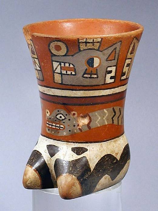 Peru, Wari Effigy Vessel of a llama hoof
The llama hoof is decorated in three bands, the upper with two sets of  sun/moon heads facing each other. The middle band has an undulating serpent and the lower band is a black on white llama skin decoration.
Media: Ceramic
Dimensions: Height 5"
Price Upon Request
M3079