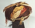Chile, Cameronie turban with henna colored hair with upright fiber tassel
Textile