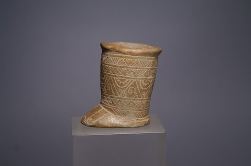 Ceramic: Monteno incised ceramic container in the form of a  foot with suspension hole $950