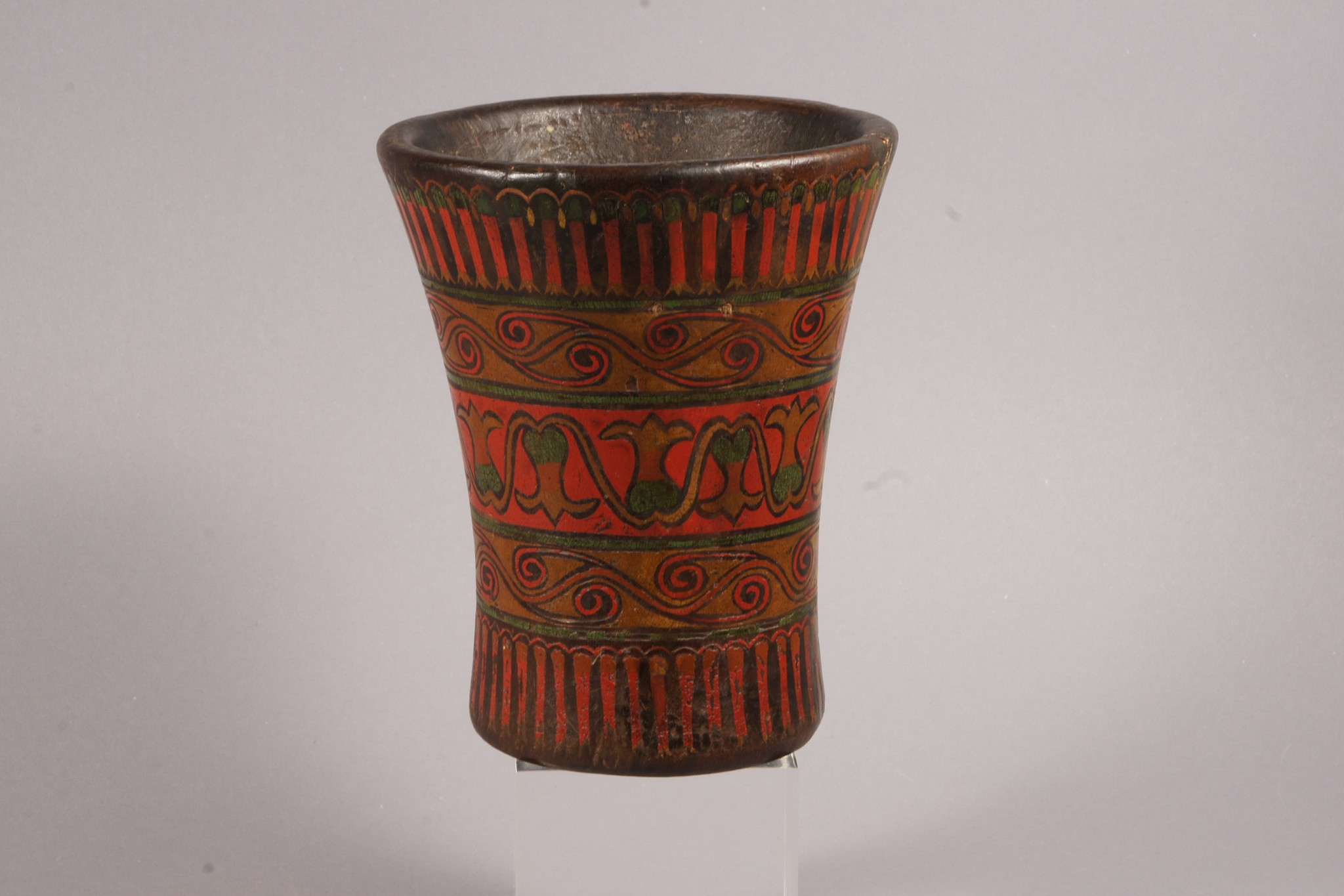 Peru, Colonial Qero with floral motifs in registers
Decorated in five registers with flowers, the pair to this vessel is in the Museo Inka, Universadid Nacional del Cuzco and illustrated in Ochoa et. al. "Qeros: Arte Inka en vasos ceremoniales" (1998: 267). Some were made in pairs, particularly in the Colonial period. Qeros were festive drinking cups that Inca rulers, governors and other state officials used in ceremonies, and they were often gifted from one lord to another. Hans Monheim collection - Aachen Germany  since 1950's.
Media: Wood
Dimensions: Height  6 1/2: x Width: 5 " across the top
Price Upon Request
M4044