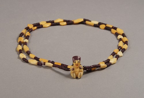 Bone: Nazca necklace with bone and syondylus beads and a minature female pendant $6,500