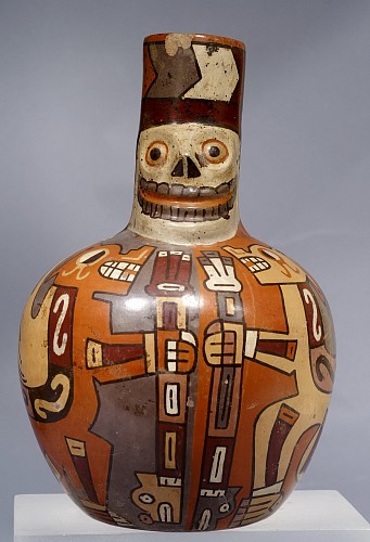 Ceramic: Wari Death-head Vessel with winged felines Price Upon Request