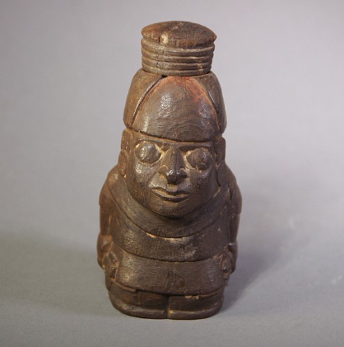 Large Wari wooden lime container in the form of a seated man Price Upon Request