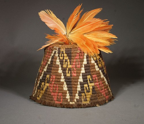 Inca fez style hat with step design in brown, gold, white and pink and feather plume $5,500
