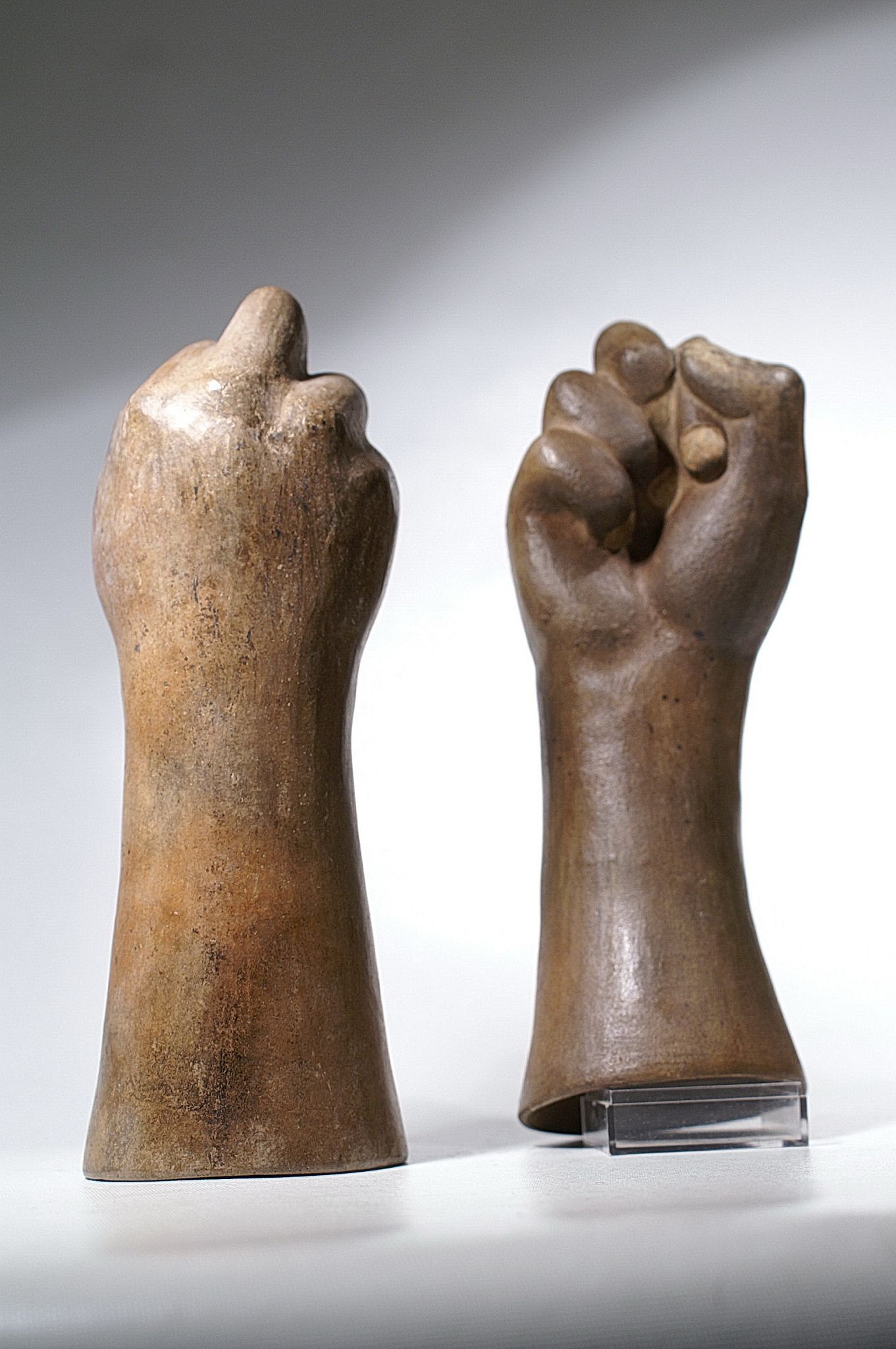 Peru, Two Moche Ceramic Hands with Clenched Fists
Although hands such as these are well documented for the Moche, it is rare to find two together from the same artist / workshop. The clenched fist, with raised middle knuckle, represents mountains and highland lagoons where sacrifices and divinatory rituals took place (Donnan, Moche Art of Peru 1978: 152-153 and fig. 235). Christopher Donnan further discusses the symbolism of such hands in "Andean Art at Dumbarton Oaks (1966: I: 136-139), where a bone carved as a clenched fist was studded with inlays of precious turquoise.
Media: Ceramic
Dimensions: Height 10"( 25cm) and Height  9 3/4"(24 cm)
Price Upon Request
M6064