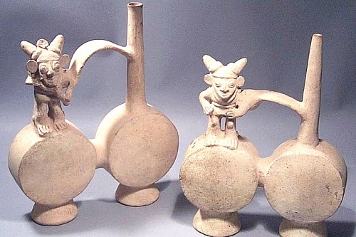 Peru - Pair of Chancay White, Double-chambered Whistling Vessels with figures Price Upon Request