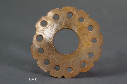 Peru - Early Middle Horizon Mother of Pearl Round Ear Spool Front with 13 Petals Price Upon Request