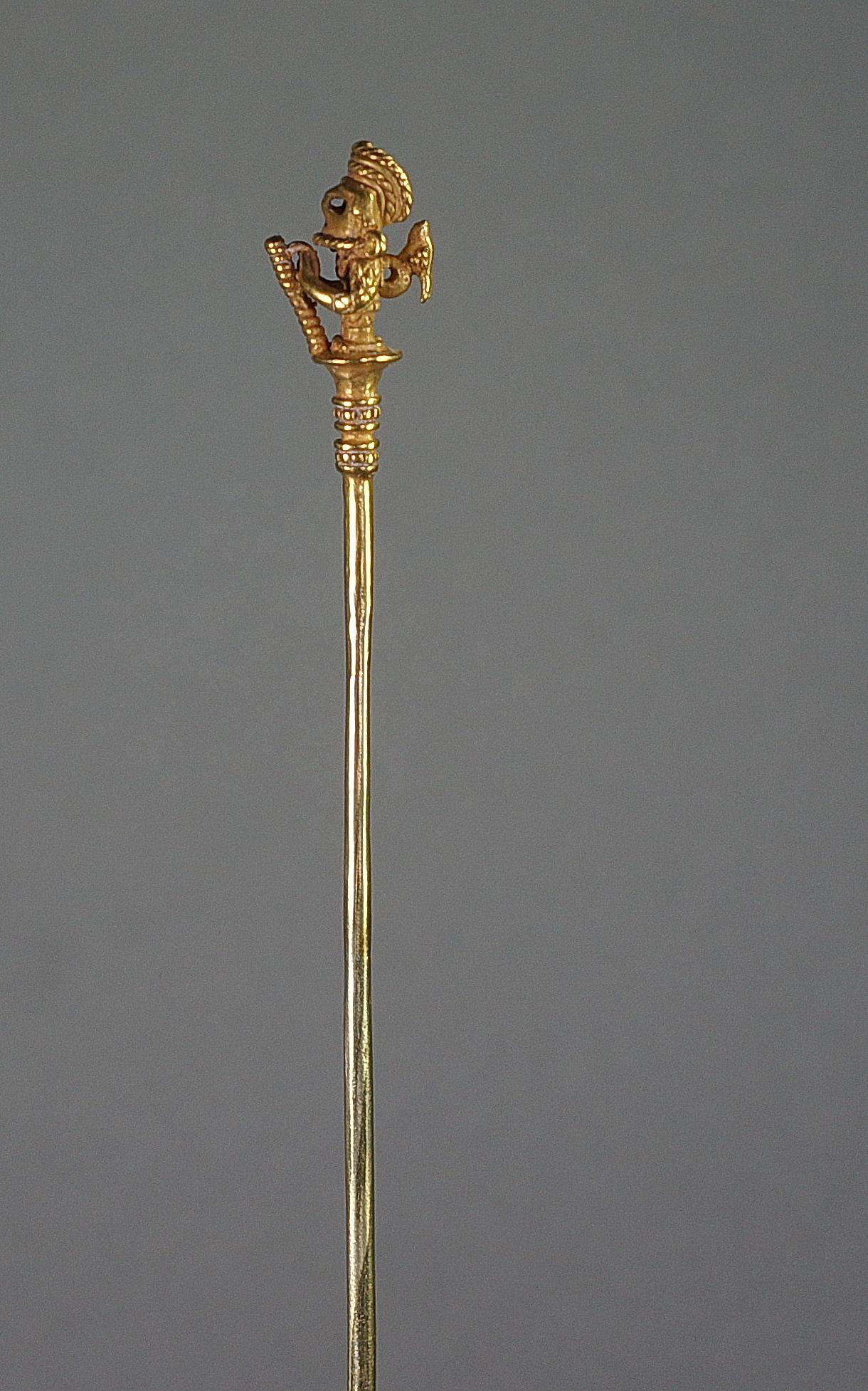 Colombia, Calima Cast Gold Lime Dipper of a Warrior with Animal Perched on Back
Finely cast with tapering shaft terminating in two bands of granulation. Elaborate helmeted warrior wearing a mask and holding a staff with both hands, curving headdress and miniature animal perched on back.  According to the research, only limited types of images were used for lime dippers, usually shamans or warriors.  See "Calima and Malagana," by Marianne Cardale Schrimpff, p. 115, plate 111.34 for a similar example.  Excellent example of lost wax casting.  Sotheby’s, New York, private collector, prior to 2000.
Media: Metal
Dimensions: Height: 8 1/4"
$14,750
MM618