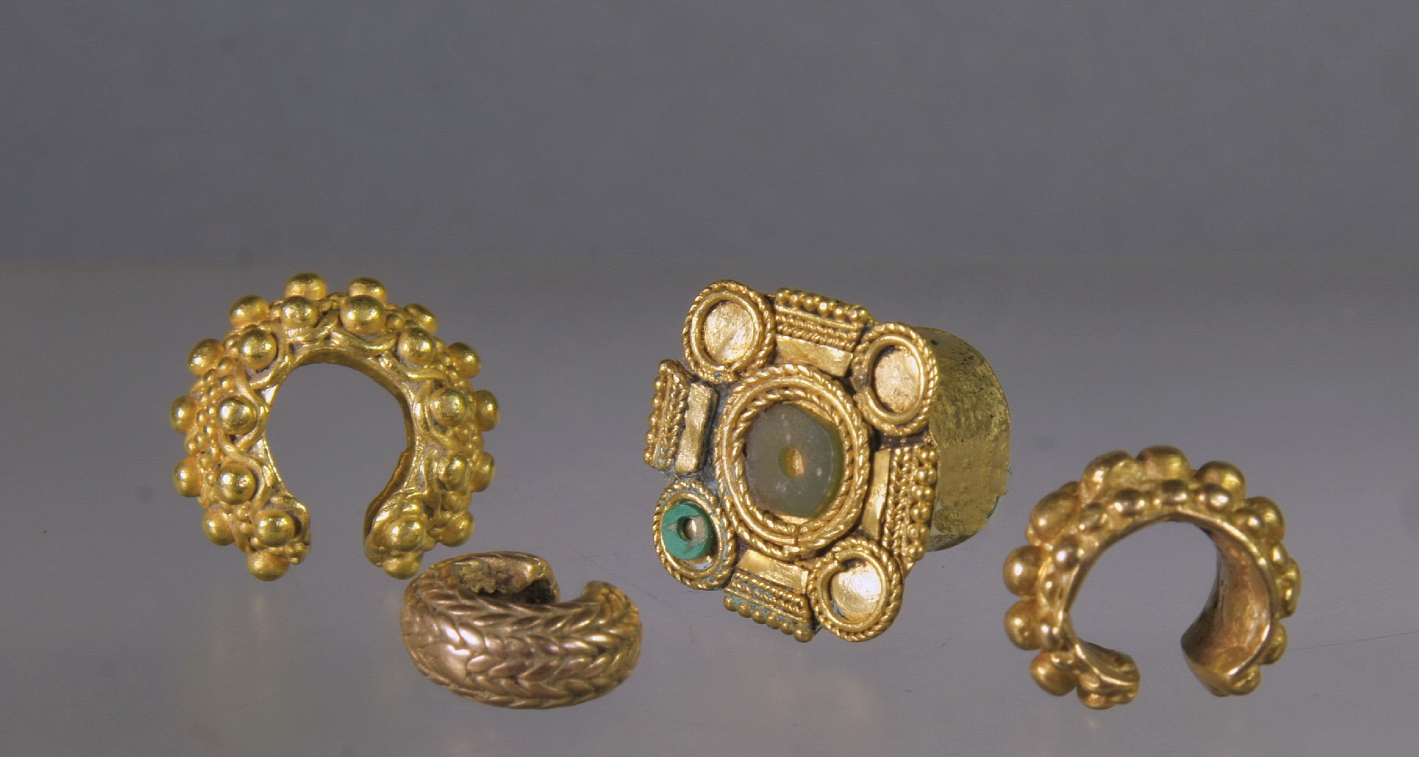 Ecuador, Tolita Gold Ornaments
A set of 4 gold ornaments comprising four hollow ear and nose ornaments, three repousse, the last containing rattles, a solid twisted bracelet of U-shape, the last an ear ornament soldered with a frontal with raised roundels once inlaid.
Media: Metal
Dimensions: Diameters are 7/8 to 2 3/8 inches.
$4,500
99128