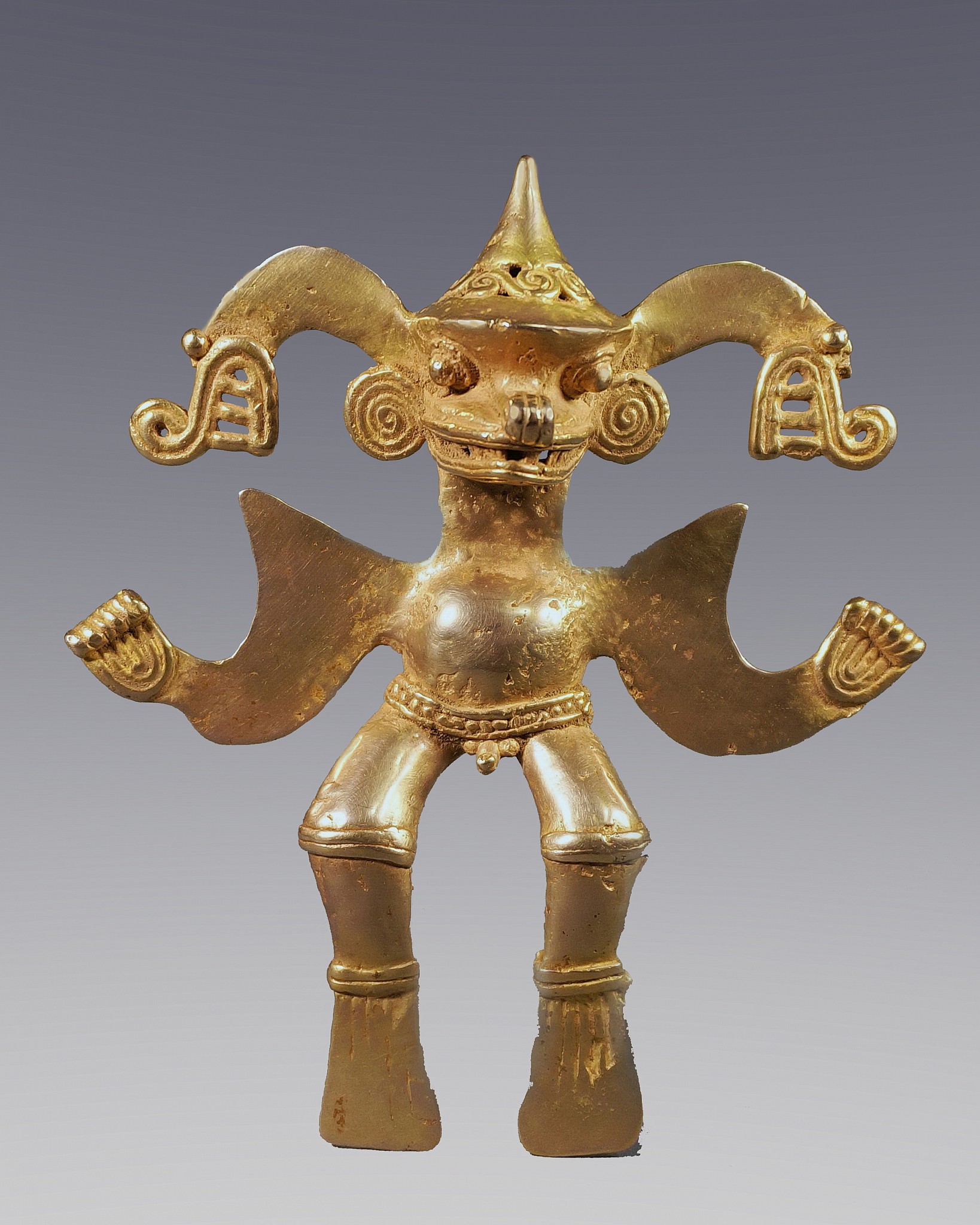 Costa Rica, Diquis Cast Gold Anthropomorphic Figure with a Cone Shaped Crown
The figure has a crocodilian nose and mouth with serpents emanating from his head and wears a cone-shaped crown.  His hands are held outward with broad shoulders which could also be wings, and his flipper-shaped feet are typical of the Diquis region which borders Panama. Crocodiles, or Saurians are not often depicted as standalone figures.  A very similar shaped figure, but smaller and without the helmet is illustrated in THE ART OF PRECOLUMBIAN GOLD - The Jan Mitchell Collection, #6.   Another similar figure is in the Janssen Collection in Antwerp.  Both have a male phallus.   
Media: Metal
Dimensions: Height: 4 3/16" x Width:3 3/4",Weight: 99.6 gramsXRF Au. 72%, Cu. 24%, Ag. 2.4%
Price Upon Request
n7031