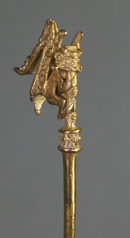 Colombia, Early Calima Gold Lime Dipper
A fine lost wax cast lime dipper with a mythological monkey deity on the tip.  The monkey is wearing a helmet, ear spools, and an elaborate headdress which falls down the back of his body.   The monkey is grasping the shaft of the lime dipper.  Lime dippers were used to administer lime for the coca ceremony.  According to the research, only limited types of images were used for lime dippers, usually shamans or warriors.  (See "Calima and Malagana," by Marianne Cardale Schrimpff).   A similar but not exact motif is illustrated in ORFEBRERIA PREHISPANICA DE COLOMBIA  Vol. Estilo Calima - Laminas Page 84  Num. 5232.
Media: Metal
Dimensions: Length 8 1/2"
$12,000
97146