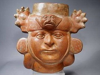 Peru, Moche Portrait Vessel of a Lord
Reddish brown ceramic, open top, portrait vessel of a man wearing ear spools and a headdress with a puma head motif and two enormous front paws emerging from the sides. There are traces of spotted, beige slip decoration on the ear spools and spots on the headdress. This vessel is significantly larger than most portrait heads which average slightly more than half life-size, and it is in good condition. Portrait vessels play a significant role in Moche art as forerunners of a period of realism that followed them. It is believed that portraits were of powerful leaders, and that their presence in a grave signified an honor bestowed upon the deceased. A very similar portrait vessel is illustrated in "Ancient Peruvian Ceramics: The Nathan Cummings Collection," by Alan Sawyer (1996: pl: 37). Another, perhaps of the same person, is illustrated in "Moche Portraits from Ancient Peru" by Christopher Donnan (2004: fig.: 4.27).
Media: Ceramic
Dimensions: Height: 9 3/4"
Price Upon Request
96077