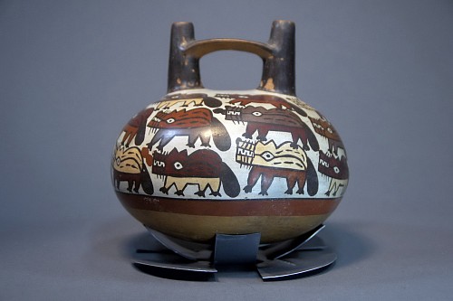 Ceramic: Nasca Bridgespout Vessel Painted with 23 Foxes On White Ground Price Upon Request