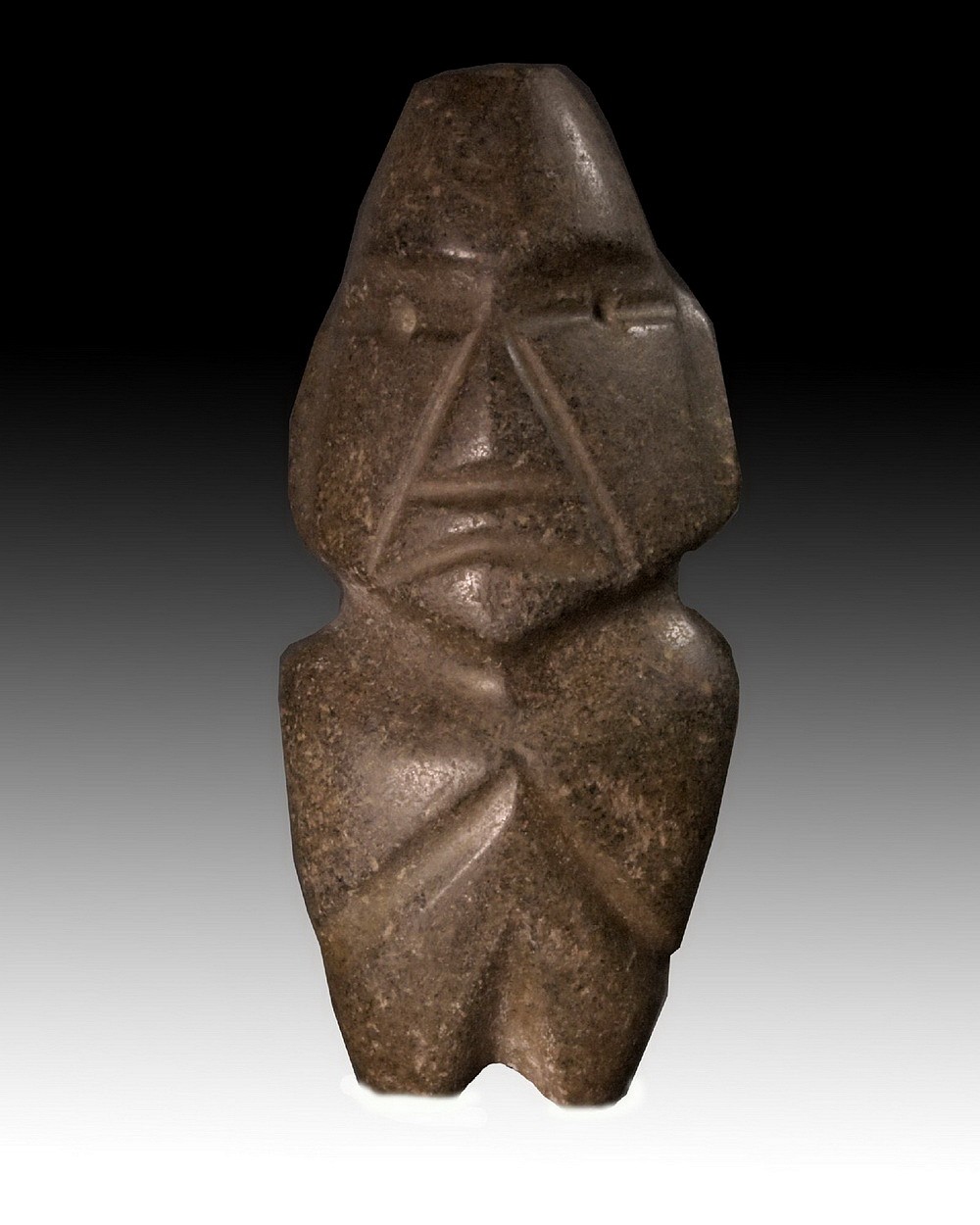 Mexico, Classic Brown Stone Mezcala Figure of the M8 Type
This hand-held stone figure fits perfectly in the palm of the hand and bears a distinctive facial expression with round eyes and a triangular frowning mouth.  The figure was created using the string-sawing technique and is made of a greenish grey stone with earth brown striations.  It was highly polished.  The figure has its arms to the side, represented by carved grooves, and linear carved face, which are both characteristics of Type M10 Mezcalas.  The representation of human figures played an important role in Mezcala culture, including in rituals and burial sites.  However, most of these figures, were used for utilitarian purposes as celts or chisels.  For a reference see the Primitive Museum of Art's MEZCALA STONE SCULPTURE: THE HUMAN FIGURE, p.22-23, and MEZCALA: ANCIENT STONE SCULPTURE FROM GUERRERO MEXICO, by Carlo Gay and Frances Pratt. Ex. Gallery Hana-Tokyo, prior to 1970.
Media: Stone
Dimensions: H: 5 in. x 2.33 in.
Price Upon Request
n5057