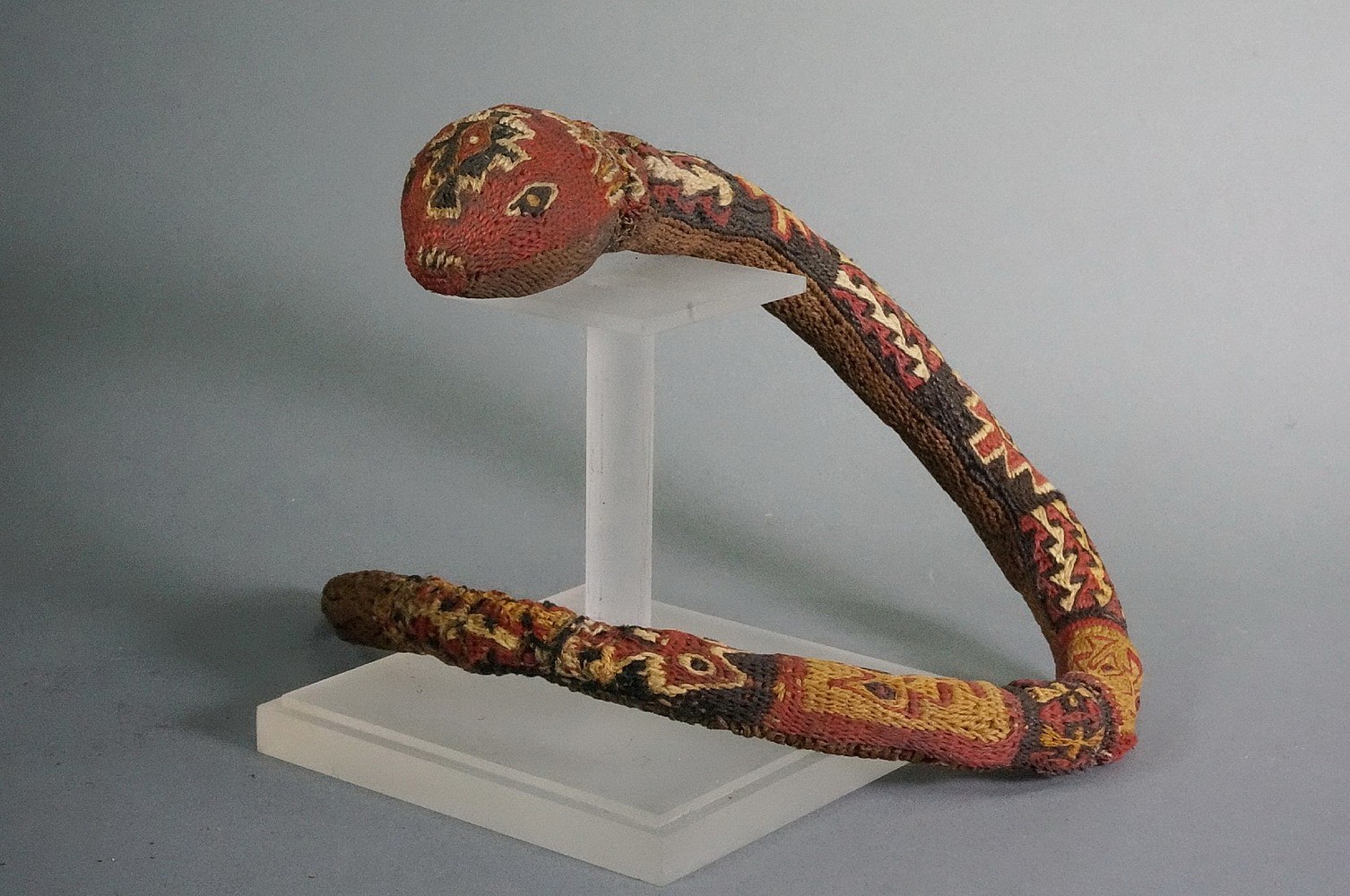 Peru, Wari three dimensional coil woven snake dance wand
Shamans use dance wands hypnotize their attendants.   This wand has 6 different patterns on its back and a solid brown underside.  The tip has a 3" section of woven hemp which appears to be poisonous. There are many poisonous snakes in Peru including the dangerous Bushmaster.   Formerly in the collection of Justin and Barbara Kerr, acquired from Alan Lapiner in 1967.
Media: Textile
Dimensions: Length: 19 1/2" x Diameter: 1 1/2" tapering to 3/8"
Price Upon Request
n7016