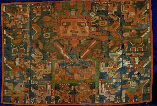 Sihuas Tapestry Panel Depicting a Sun Face Deity Holding a Staff in Each Hand $18,000