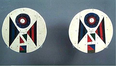 South Africa, Zulu Wood Earplugs with Red, Blue and White Vinyl Asbestos Mosaic Overlays
The custom of ear piercing was an important ceremony performed on every Zulu child before reaching puberty.  As the pierce hole healed, larger and larger pieces were put into the hole until it was big enough for pieces of reed to be used.  By the 1950s the advent of vinyl asbestos flooring materials inspired a fashion for much larger and more elaborately designed wood plugs.  The vinyl was cut into geometrically designed patterns for overlaying the wood.  These particular earplugs are distinguished with the patterns and colors attributed to the Msinga district of KwaZulu, near Johannesburg.   Wearing ear plugs signified that an individual was of Zulu origins.  Very similar examples are illustrated and discussed in "Africa:  The Art of a Continent", Prestel, New York, 1999, p.219.
Media: Wood
Dimensions: Diameter: 2 5/8"
$2,000
98038B