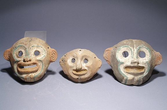 Ecuador, Pair of Jamacoaque Monkey Maskettes
These small monkey masks were decorated with post-fire pigments in blue, green, and white over a gray slip, and were probably headdress adornments for a larger ceramic effigy figure. The artisan clearly intended these masks to depict howler spider monkeys (Ateles paniscus), the largest primates in the New World.  These monkeys prefer the branches of the upper forest canopy, where they feast on ripe fruit supplemented by leaves and insects.  In the Amazonian mythology monkeys are associated with creator deities and cultural heroes who bestowed gifts of abundance.  Monkeys were understood by ancient Andeans to be older spirits reincarnated from a mythical period prior to the presence of human beings on earth.  For further reading on the legends of tropical peoples see Klein and Cevallosâ€™ "Ecuador: The Secret Art of Pre-Columbian Ecuador," 2007, page 25.
Media: Ceramic
Dimensions: Height: 3" to 4"
Price Upon Request
M7102AB