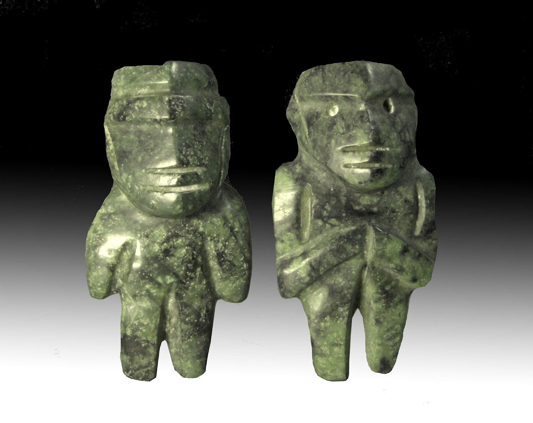 Mexico, Pair of Miniature Dark Green Jadite Mezcala Figures of the M16 Type
These miniature dark green jadite figures, male and female, bear serene facial expressions and body language.  The figures were created using the string-sawing technique and are made of an extremely smooth and dark jadite native to South America, characterized by a network of deep green and blue-black veins.  The figures have complex faces and arms that stand out in relief, which makes them category Type M16  Mezcalas.  The representation of human figures played an important role in Mezcala culture, including in rituals and burial sites.  Its rare to find a male and female  made as a pair. For a reference see the Primitive Museum of Art's MEZCALA STONE SCULPTURE: THE HUMAN FIGURE, p.22-23, and MEZCALA: ANCIENT STONE SCULPTURE FROM GUERRERO MEXICO, by Carlo Gay and Frances Pratt, plate 61.  Ex. Gallery Hana-Tokyo, prior to 1970.
Media: Stone
Dimensions: H: 2.5 in. x W: 1.25"
$2,400
n5058
