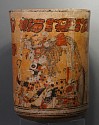 Guatemala, Mayan Polychrome Ceramic Cylinder Vessel with Ruler and Otherworld Serpent Deity
Ceramic
