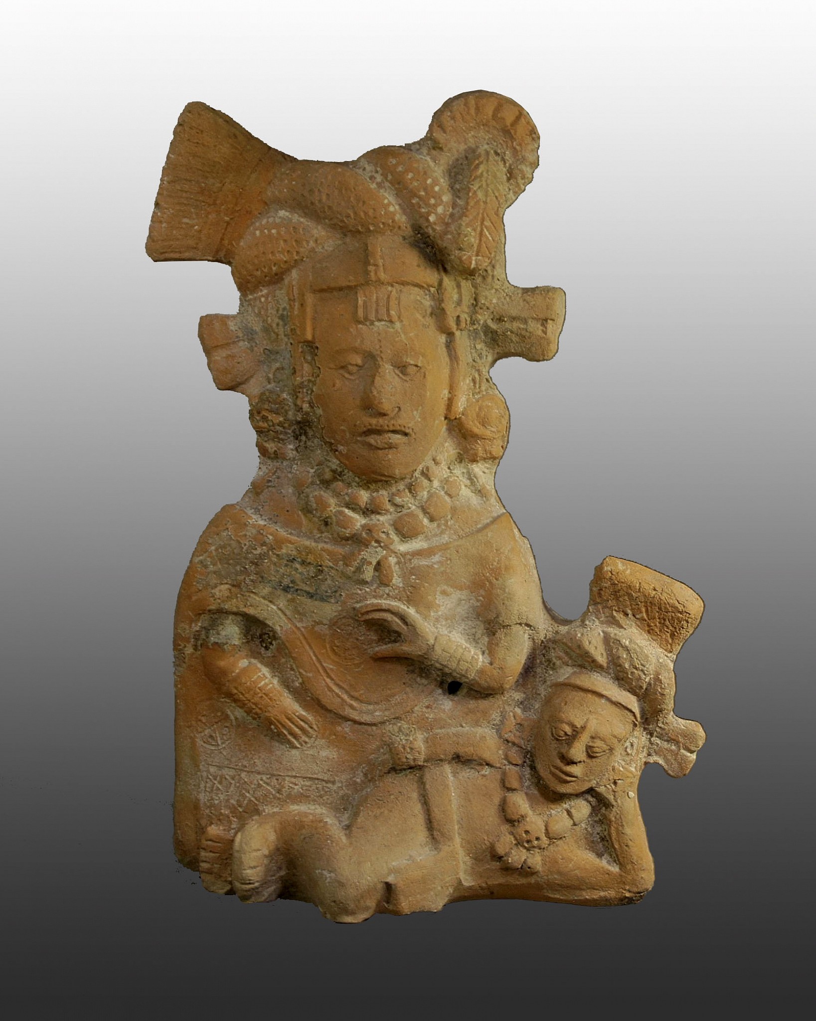 Mexico, Mayan Ceramic Figural Rattle of A Female Figure with Child
This high-ranking noble Jaina female wears a cloth and feather turban, ear spools, a heavy beaded collar piece and a slip-on quexquemitl over a skirt decorated with roundels and cross-hatching around the hem. Her face has a discreet scarification pattern in the center of the forehead and around the upper lip. The male child lying at her feet has a similar turban, beaded necklace, and a simple loincloth. Jaina-style figurines were exchanged along a 500 mile trade route.  These figurines were hand-modeled with hollow, mold-made bodies, and joined to plain backs made by hand or molded. This figure can function as a whistle, flute, or rattle. For the Maya, enabling figurines to make sound animated them with the essence of life: air.
Media: Ceramic
Dimensions: Height: 8 1/2"
$4,500
N6011