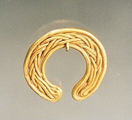 Peru, Chavin Gold Miniature Ornament 
This Chavin gold ornament was formed of braided gold wire in a horseshoe shape.  Gold was revered in the ancient Andes and this ornament would have been worn by a high-status individual.
Period: Peru, Chavin, Late phase, North Coast, c. 600 - 400 BC
Media: Metal
Dimensions: H: 6/8"
$750
90088