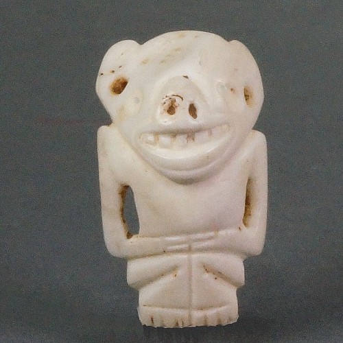 TaÃ­no Carved Shell Amulet of a Figure with a Bat Face $2,250