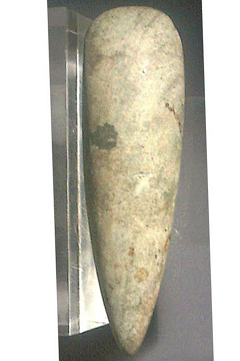 Dominican Republic, Taíno Petaloid Celt
This celt is made of slender light gray hued stone with swirled and spotted surface carved into petaloid form.  Good examples of petaloid stone celts are illustrated in "Taíno: Pre-Columbian Art & Culture From the Caribbean", Museo del Barrio, 1998, Fig. 24.
Media: Stone
Dimensions: Length:6 3/4" x Width: 2"
$6,500
MM052C