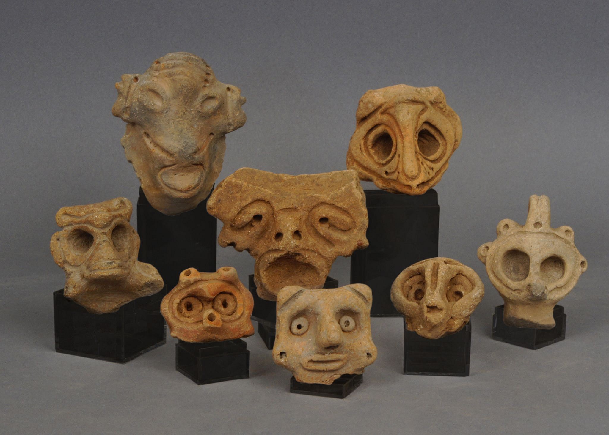 Dominican Republic, Set of 8 Taíno  Ceramic Anthropomorphic Faces
These heads were used as adornos (decorative handles) on ceramic plates and bowls.
Period: Dominican Republic, Taíno , c. AD 1000 - 1500
Media: Ceramic
Dimensions: Approximately. 1-3" in height.
99450