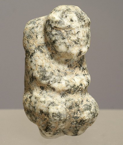 TaÃ­no  Speckled Stone Amulet of a Chief Sitting on a Duho Stool