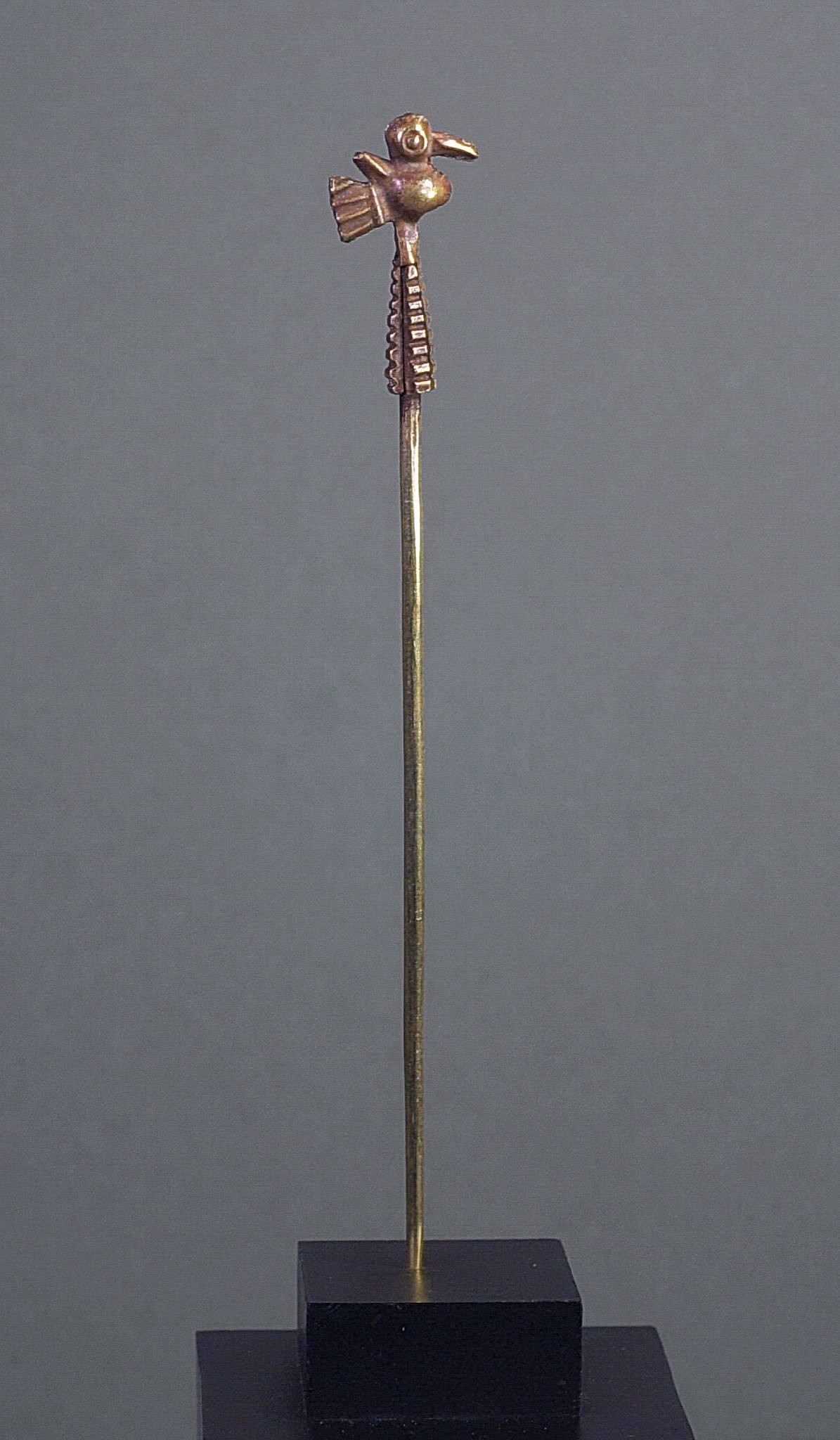 Peru, Inca Gold Fastening Pin Topped with Bird Perched on Corn Cob
Gold works of art from the Inca period is rare, as most Inca gold was confiscated and melted down by the Conquistadores during colonization.  This apparently simple cast pin is quite complicated in its manufacture.  The pin and the corn cob were cast, whereas the bird is made of a separate stamped sheet - designed head-to-head, bent, and soldered to itself.  The bird was then fitted over the top to create the appearance of a single cast object.  A similar piece appears in Kunst Und Kultur von Peru (Art and Culture of Peru) by Max Schmidt, page 396.  From a private Florida collection, acquired prior to 1980.
Media: Metal
Dimensions: Length: 5"  Weight: 4.7 grams.
$1,950
MM625